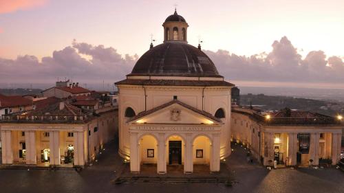 a large building with a tower on top of it at Maison Martina in Ariccia