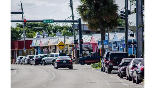 a street with cars parked on the side of the road at Wilton Manors Guesthouse in Fort Lauderdale