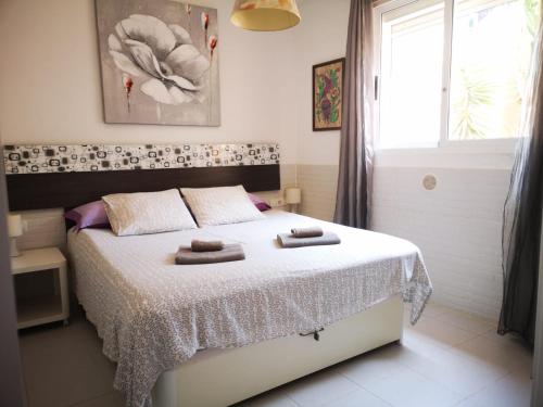 A bed or beds in a room at LasVistasApartment
