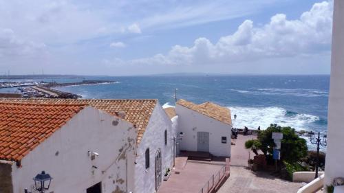a view of the ocean from a building at Sa Caletta Appartamenti in Portoscuso