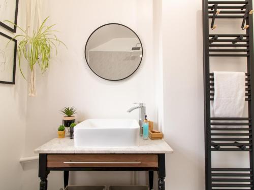 a bathroom with a sink and a mirror on the wall at Pass the Keys City Convenience in Stanley