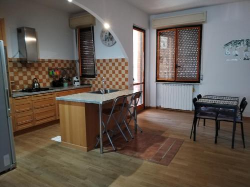 a kitchen with a sink and a counter top at Casa Mirella in Siena