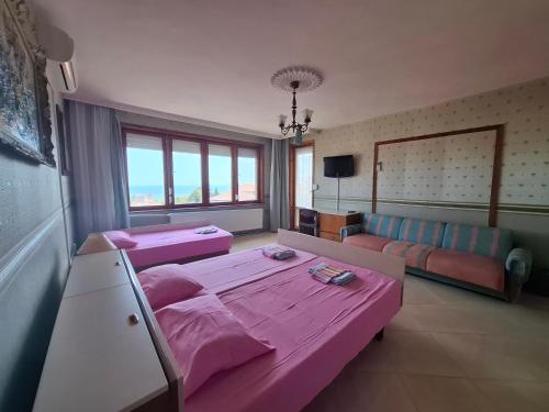 Postel nebo postele na pokoji v ubytování Guest House Maria