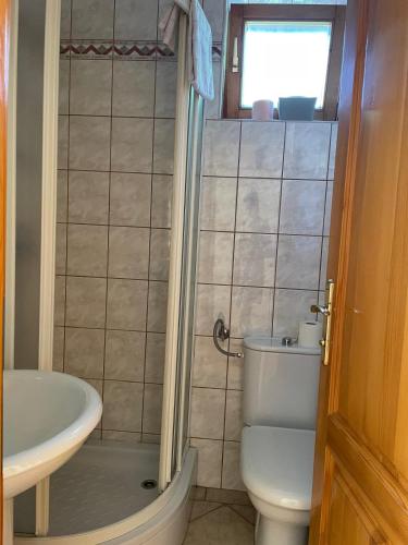 a bathroom with a toilet and a sink at Green House Livno in Livno
