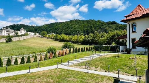a view of a garden from a house at Casa Tudorescu in Horezu