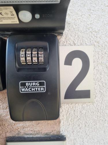 a close up of a bug water meter with a sign at TWO Self-Check-In, 3km freeway, Free-Parking Playstation in Wolfpassing an der Hochleithen