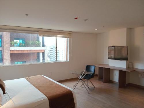 Postel nebo postele na pokoji v ubytování Hotel Lomas 10 Medellin