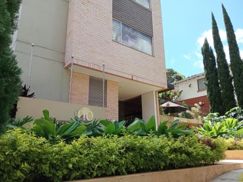 a house with plants in front of it at Hotel Lomas 10 Medellin in Medellín