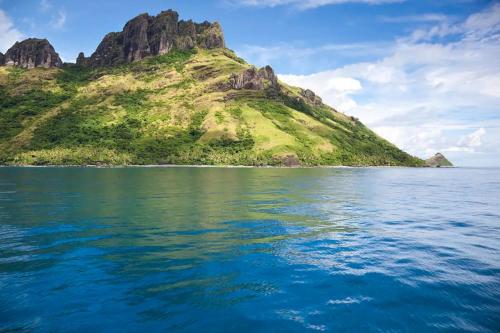 an island in the middle of a body of water at Jolame Homestay Experience in Wayasewa Island
