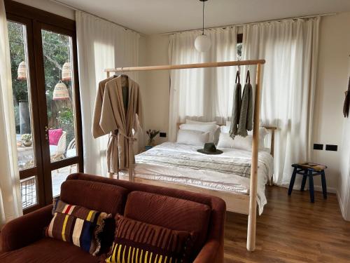 Ένα ή περισσότερα κρεβάτια σε δωμάτιο στο The Suite Vally