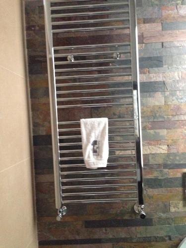 a shower stall with a white towel on it at B&B Numero Uno in Bisceglie