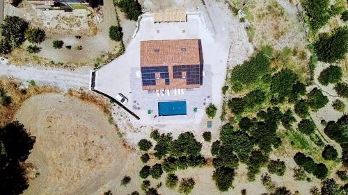 an aerial view of a building with a blue garage at Villa Cirasa in Aragona