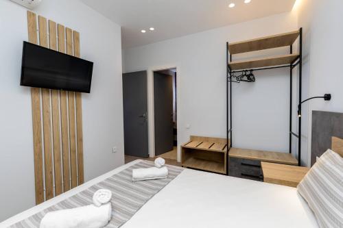 Ένα ή περισσότερα κρεβάτια σε δωμάτιο στο Enalia Luxury Living