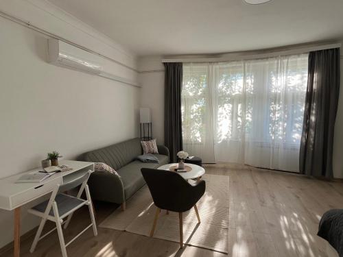 a living room with a couch and a table at Mavino Apartment Zagreb in Zagreb