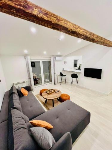 a living room with a couch and a table at SaraRose in Sarajevo