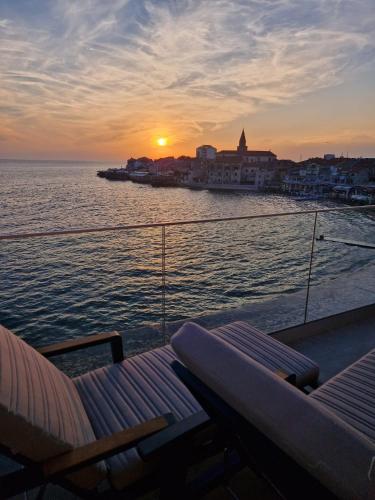 a view of the sunset from the deck of a boat at Calypso Residence in Umag