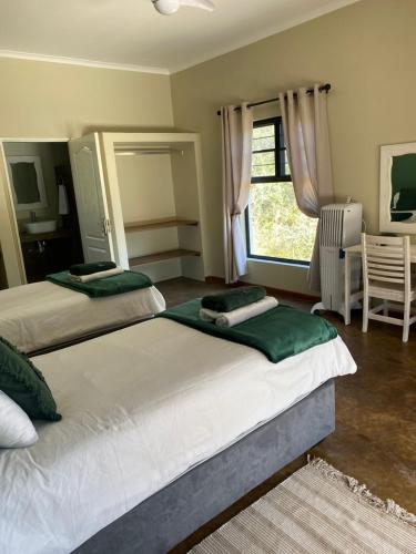 Letto o letti in una camera di Olienhoff Guesthouse and Rest Camp
