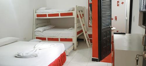 Postel nebo postele na pokoji v ubytování Hospedaje Carmelita Tocaima