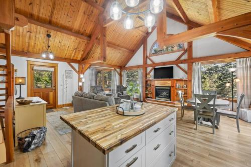 a kitchen and living room of a cabin at Whispering Pines Cabin in Rapid City