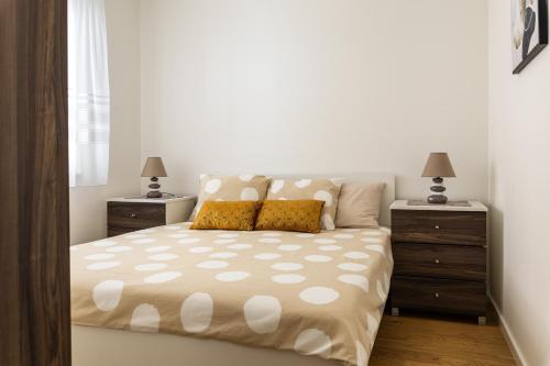 Postel nebo postele na pokoji v ubytování NinaS Apartman