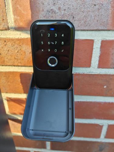 a cell phone is attached to a brick wall at Apartment Marissa in Billerbeck
