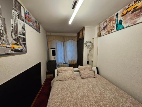 a bedroom with a bed with two pillows on it at Great Apartment near Bern & Up to 7 Seats Cars Rental Option in Ittigen