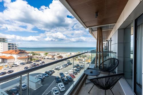 a balcony with a view of a parking lot at L&C Beach Home by Zora apartament,pe plaja in Mamaia Nord