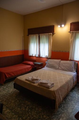 Postel nebo postele na pokoji v ubytování Hosteria Sans Souci