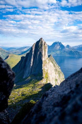 a mountain with a view of a body of water at Spacious Waterfront Gem - Panoramic View - Terrace in Fjordgård