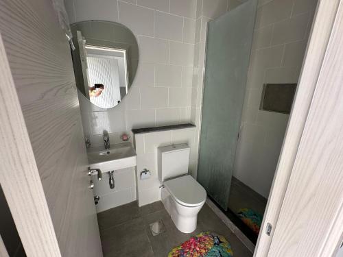 a small bathroom with a toilet and a mirror at North coast Cozy cabin Seaview & Lagon in D-bay I Beach Access Included in Zāwiyat ‘Abd al Mun‘im