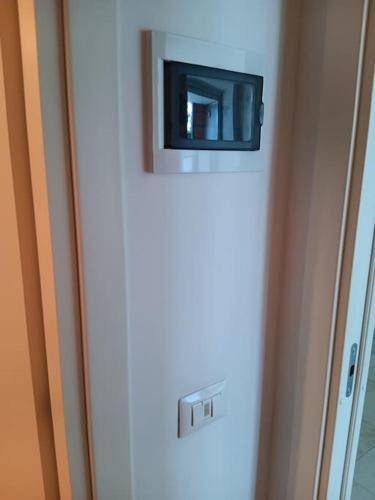 a small television on top of a refrigerator at appartamento piano terra in Eraclea Mare