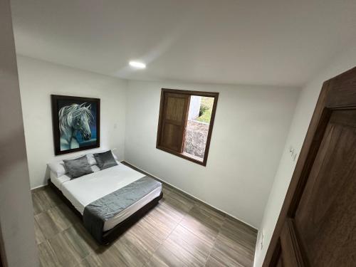 Ένα ή περισσότερα κρεβάτια σε δωμάτιο στο Apartamento cerca a charco corazón