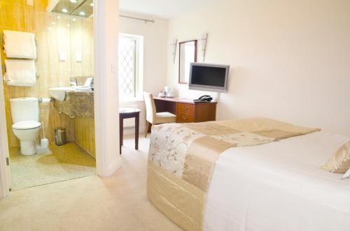 Postel nebo postele na pokoji v ubytování Norfolk Arms Hotel, Ringinglow