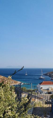 a view of the ocean from a house at Siroccos Apartment in Vlychádia