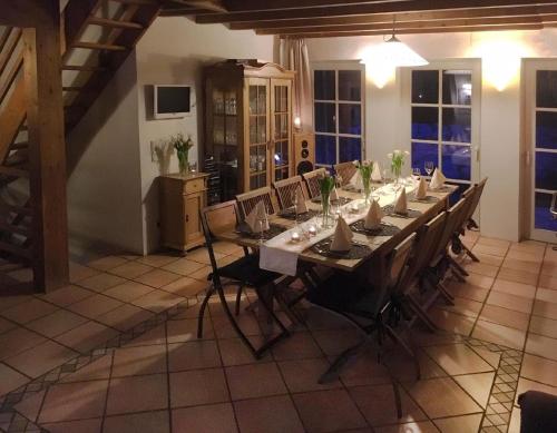 a large dining room with a long table and chairs at Ferienhaus für 7 Personen und 1 Kind in Blankenheim, Eifel in Blankenheim