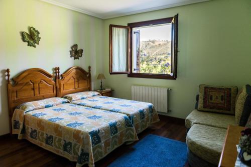 En eller flere senge i et værelse på La Mies