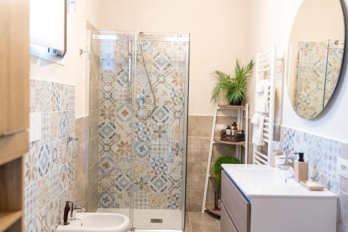 a bathroom with a shower and a sink at BBSUITE21 Maranello in Maranello