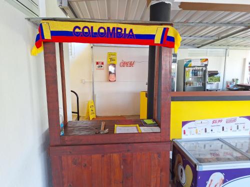 a toy gas station with a sign that reads colombia at Humacao Guest House 2 in Humacao