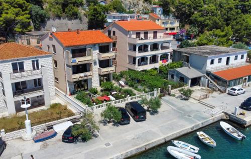 an aerial view of a city with boats in the water at Apartment Pojlicka Cesta Iv in Krilo
