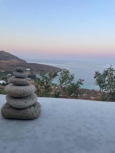 a pile of rocks sitting on top of a table at Infinity View Villa Agios Ioannis Serifos in Serifos Chora