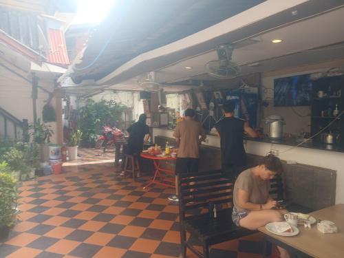 a group of people standing in a kitchen at Vientiane Star Hotel in Vientiane