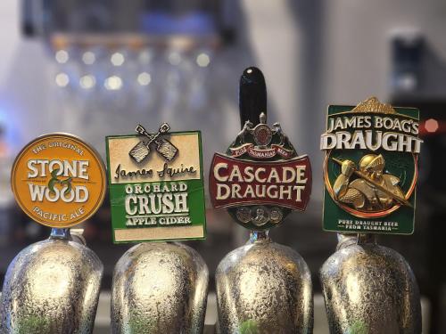 a group of three bottles of beer labels at Central Hotel Hobart in Hobart