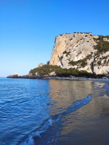 an island in the middle of a body of water at Apartment Stella Maris in Cala Gonone