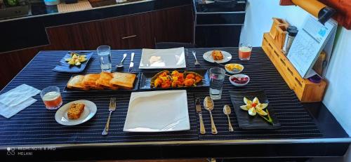 a table with a tray of food on it at Mount Elegance in Nuwara Eliya