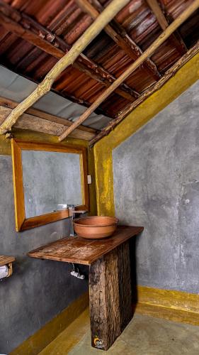 a room with a counter with a bowl on it at Habarana Tree House Ambasewana Resort in Habarana