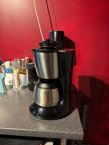 a coffee maker sitting on top of a counter at La Petite maison in Montleban