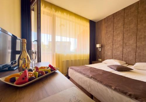 Ένα ή περισσότερα κρεβάτια σε δωμάτιο στο Paradise SPA Hotel