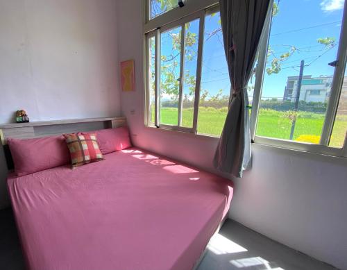 Ein Bett oder Betten in einem Zimmer der Unterkunft 豐綠民宿 Yilan Fenglu Homestay