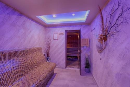 Ένα ή περισσότερα κρεβάτια σε δωμάτιο στο Paradise SPA Hotel