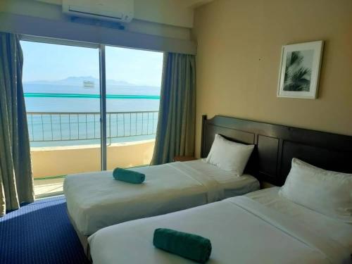 Postel nebo postele na pokoji v ubytování Ryan's Homestay